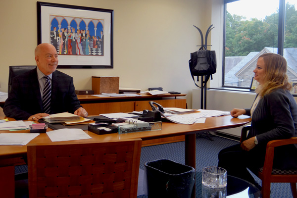 Marc Gordon and Annette at office desk